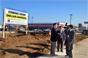Tulare County Supervisor Pete Vander Poel, left, and developer Max Bacerra, center, are interviewed at the new White River Plaza in Earlimart.