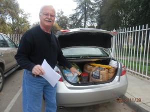 Dr. Larry Weber, an advocate for the Mooney Grove cats, drives around with cat food and supplies in his trunk.