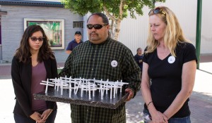 Rebecca Salgado, Louie Campos and Diane Koletzke show a group of crosses. Photo by Tony Maldonado/Valley Voice