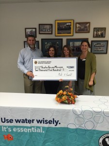 Scott Bailey, Cal Water district manager, with Jessica Cavale of the Visalia Rescue Mission, Cal Water Acting Customer Service Manager Renée Burton, and Lindsay Baldwin of the Visalia Rescue Mission