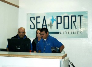 SeaPort employees Gustavo Mora, Tabitha Boese (station manager) and Yendis Sanchez work at the airline’s new Visalia counter. Photo by Nancy Vigran.