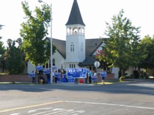 Measure I proponents held signs and chanted outside the No on I forum. Tony Maldonado/Valley Voice