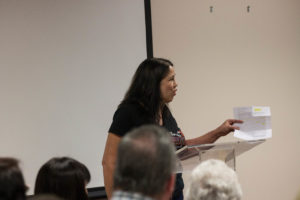 Deanne Martin-Soares holds up a copy of a letter that outlines one patient's experience at the Tulare Regional Medical Center during September's regularly scheduled TLHCD Board Meeting. Tony Maldonado/Valley Voice