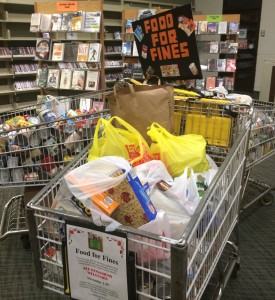 Shopping Carts in the Visalia Branch Library quickly filled up with items donated to the ‘Food for Fines’ program