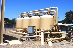 These tanks are part of an Arsenic Water Treatment Plant. Their purpose is filtration; the coagulated raw water is pumped into the tanks and the coagulant is filtered through the media within the tanks.