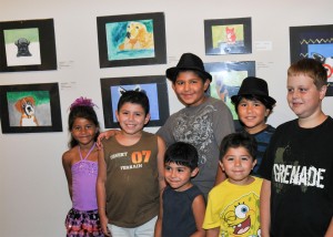 Children involved in last year’s Arts Visalia Summer Arts program show pride in their work.