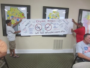 Some residents at the meeting protested Mayor Curry. Catherine Doe/Valley Voice