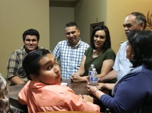 Rudy Mendoza and his wife await elections results with friends in Woodlake.