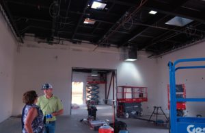 Lisa Whitworth, principal of Farmersville High, and Roland Johnston, site manager for Forcum Mackey Construction, talk amidst the construction of Farmersville High’s new Vocational Education-Career Technology Center. Nancy Vigran/Valley Voice