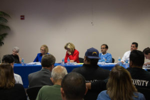 Members of the Tulare Local Healthcare District Board of Directors listen to Visalia lawyer Michael Lampe speak about recently-discovered documents relating the the district's $800,000 loan. Tony Maldonado/Valley Voice